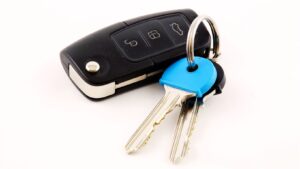 Experienced automotive locksmith in OKC unlocking a car