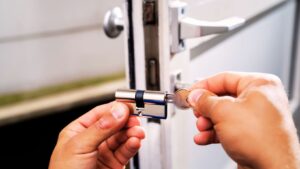 Professional locksmith in OKC repairing a home lock